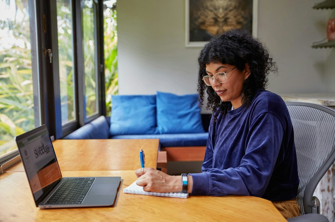 writer at desk with notebook