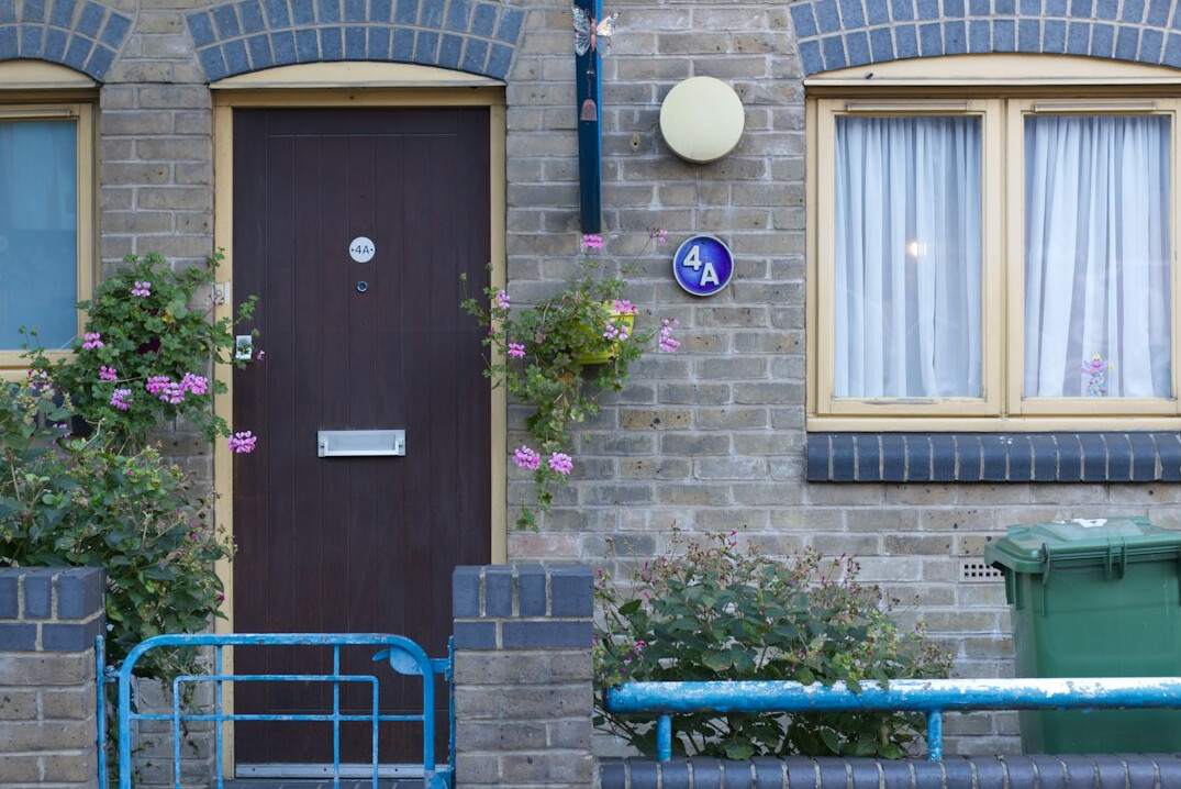 man locking front door